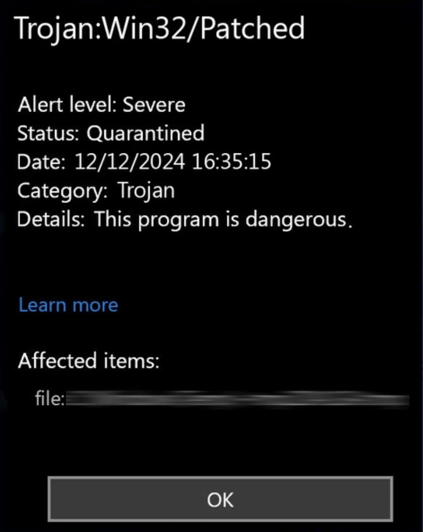 Trojan:Win32/Patched detection popup screenshot